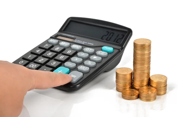 Monety i kalkulator — Zdjęcie stockowe