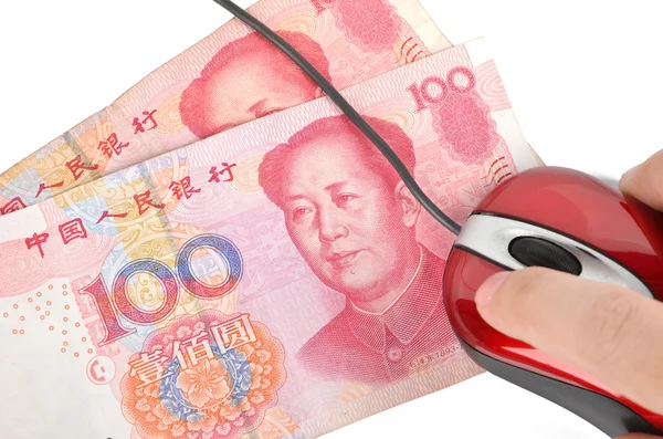 Компьютерная мышь и китайская валюта — стоковое фото