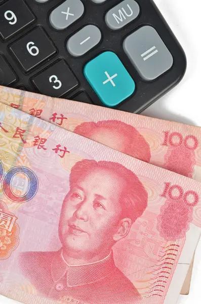 Calculator and chinese currency — Stock Photo, Image