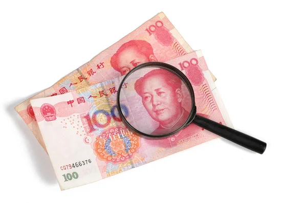 Čínská měna a megnifier — Stock fotografie