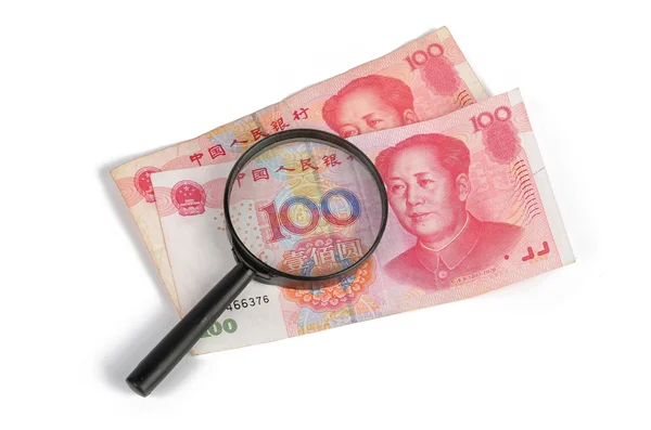 Κινεζικό νόμισμα και megnifier — Φωτογραφία Αρχείου