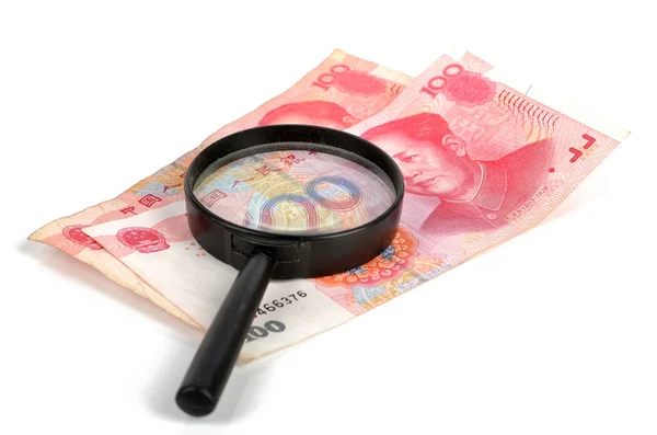 Chińska waluta i megnifier — Zdjęcie stockowe