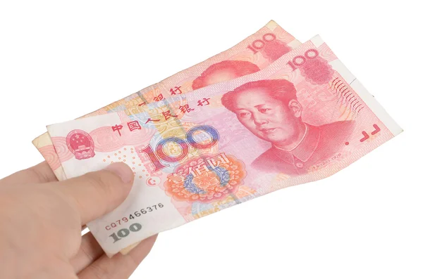 Китайская валюта и рука — стоковое фото