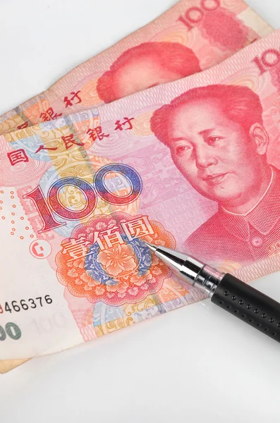 Valuta cinese e penna a sfera — Foto Stock