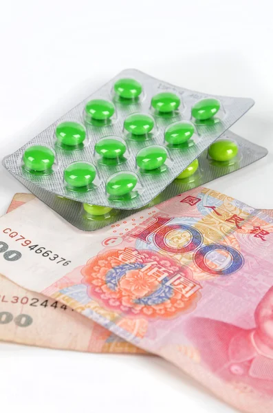 Chinese currency and medicine — Stock Photo, Image
