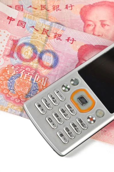 Κινητό τηλέφωνο και το κινεζικό νόμισμα — Φωτογραφία Αρχείου