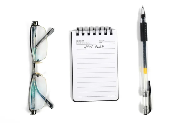 眼镜和笔的记事本 — 图库照片