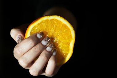 Orange in woman´s hand