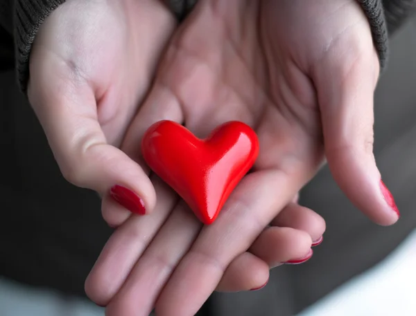 Heart in woman hands — Stock Photo, Image