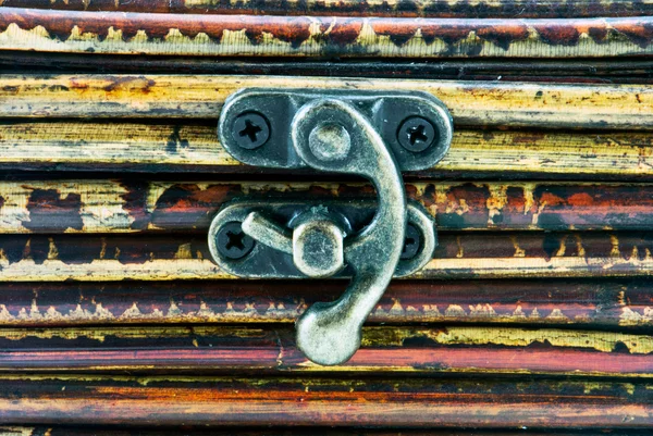 Little iron hasp on wooden background — Stock Photo, Image