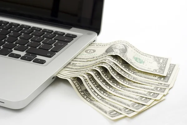 Laptop contant geld Stockfoto