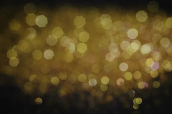 Gold lights on black background — Stock Photo, Image