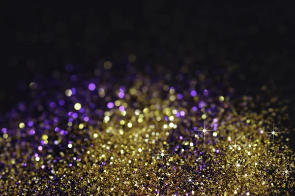 Siyah zemin üzerine altın ve mor parlak — Stok fotoğraf