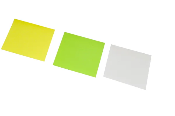 Yeşil ve sarı beyaz küçük not kağıtları — Stok fotoğraf