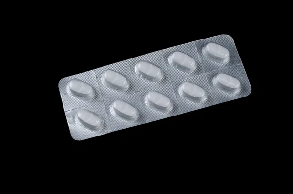 Einige weiße Antibiotika-Pillen — Stockfoto