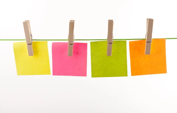 stock image Pegs and paper sheets