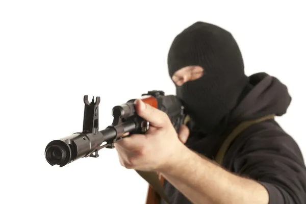 Man in mask with gun — Stock Photo, Image