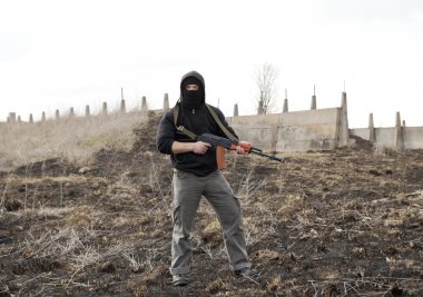 Man in mask with gun clipart