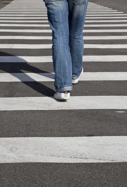 Man In Jeans Walking Across A Zebra Crossing Stock Photo - Download Image  Now - Crosswalk, Zebra Crossing, Crossing - iStock