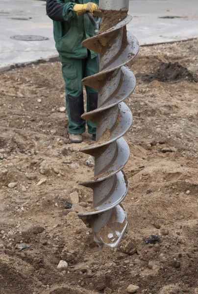 Rotary drill and worker — Stock Photo, Image