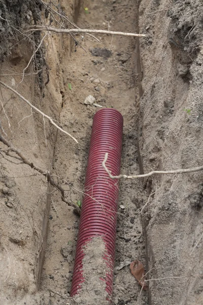 Conduit in the trench — Stock Photo, Image