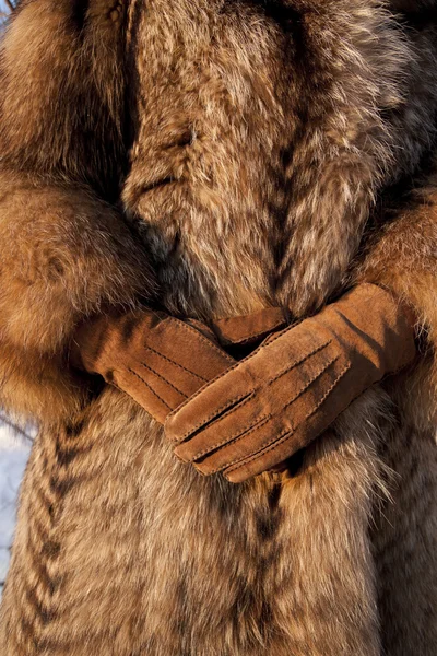 stock image Wearing fur coat and gloves in cold winter