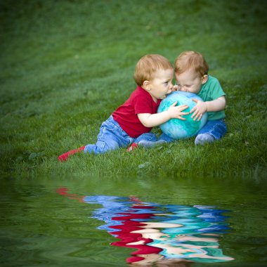 Baby boys on grass clipart