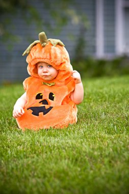 Boy in pumpkin costume clipart