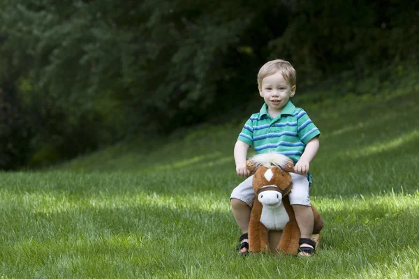 Toy horse and boy — Stock Photo, Image