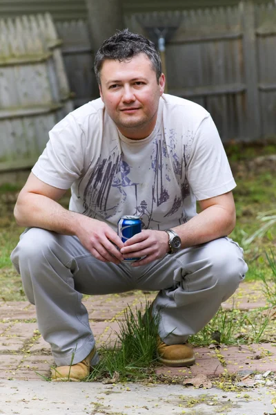 stock image Man with beer can