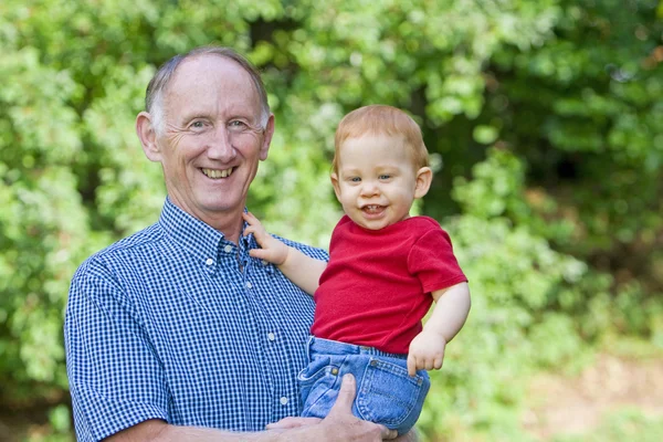 Grandfather holding baby — Stock Photo, Image