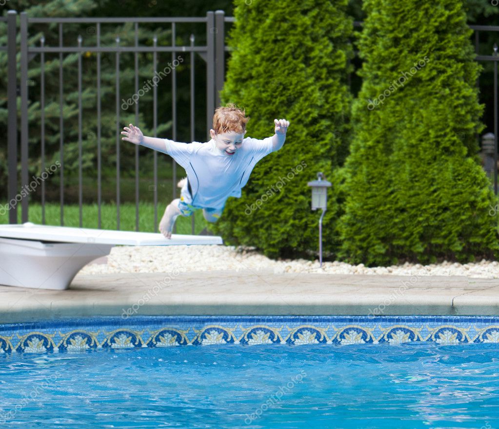Boy Jumping Into Pool — Stock Photo © Stu99 8422040