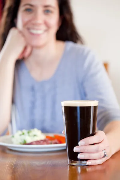 Woman with pint — Stock Photo, Image