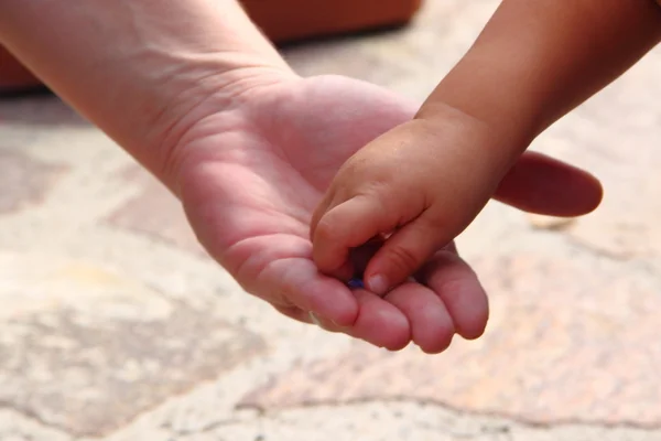 stock image From hand to hand, from present to future