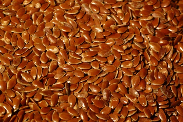 Pattern of brown flaxseeds (linseeds) — Stock Photo, Image