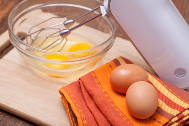 Wire whisk and eggs clipart