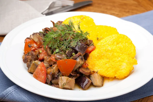 Polenta slices with vegetable stew — Stock Photo, Image