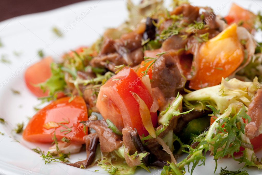 Tofu marinated in soy sauce with tomato and salad Stock Photo by