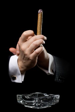 Person holding a cigar clipart