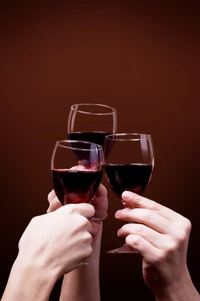 stock image Glass of red wine in hand