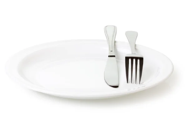 Piatto da cucina e coltello e forchetta — Foto Stock
