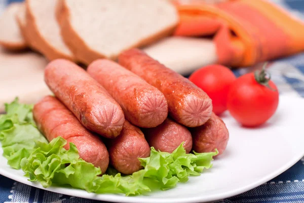 Plate with hot sausages — Stock Photo, Image