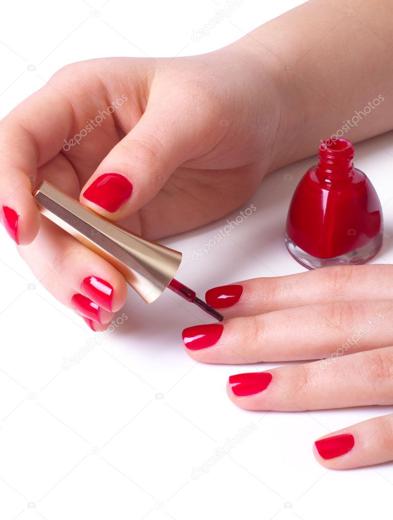 Woman applying red nail polish Stock Photo by ©gresey 8562886