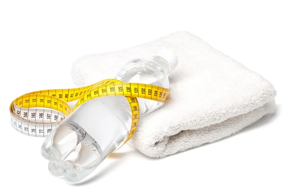 Bottle of water, towel and tape measure — Stock Photo, Image