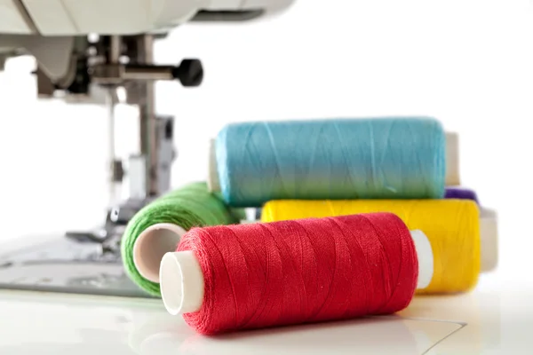 Pile of coloured bobbins of thread — Stock Photo, Image
