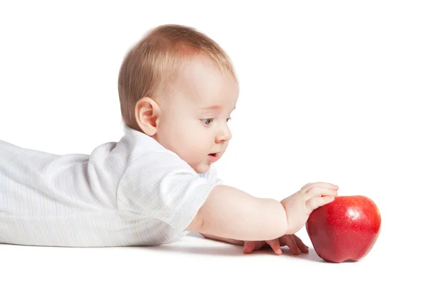 Liten bebis med äpplen — Stockfoto
