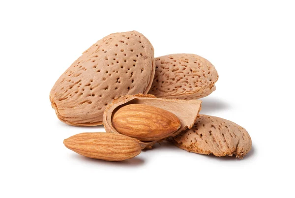 Almonds and a cracked walnut — 스톡 사진