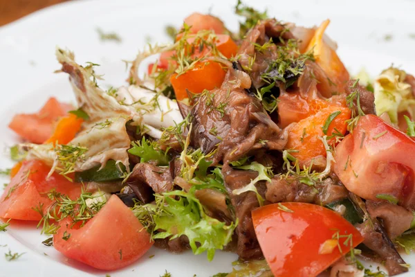Tofu marinated in soy sauce with tomato and salad Stock Photo by