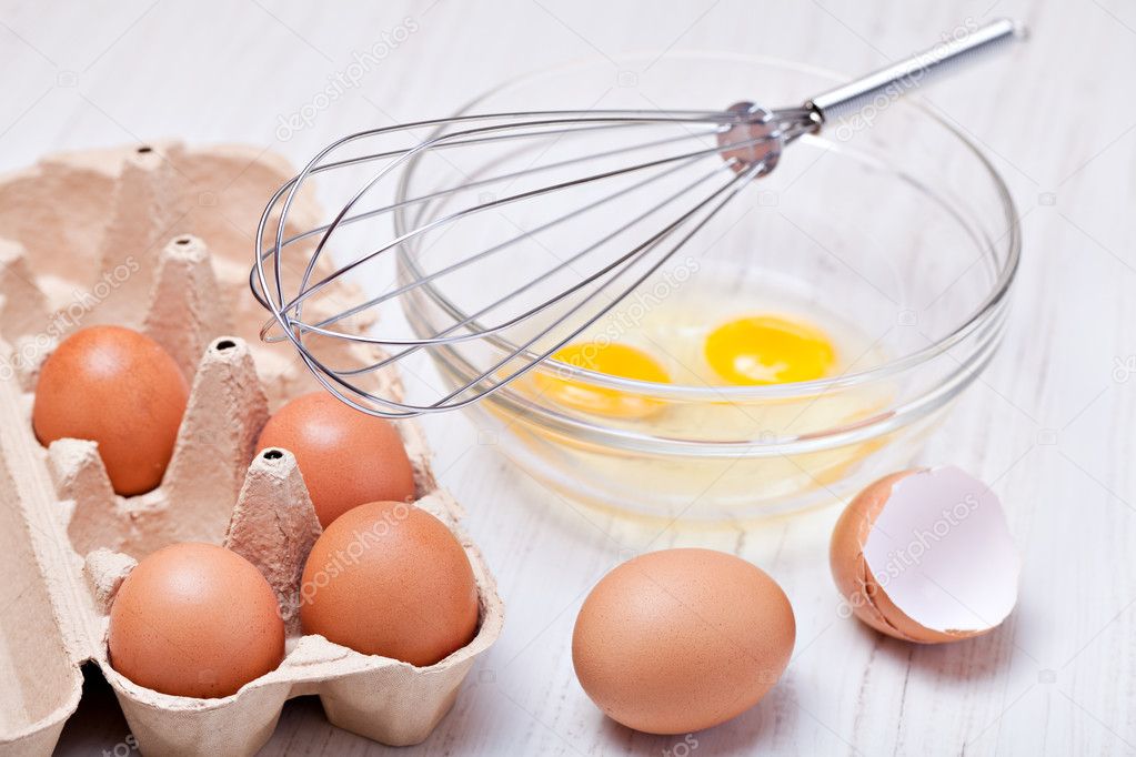 Wire whisk and eggs