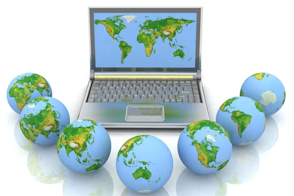 Laptop and globes — Stock Photo, Image